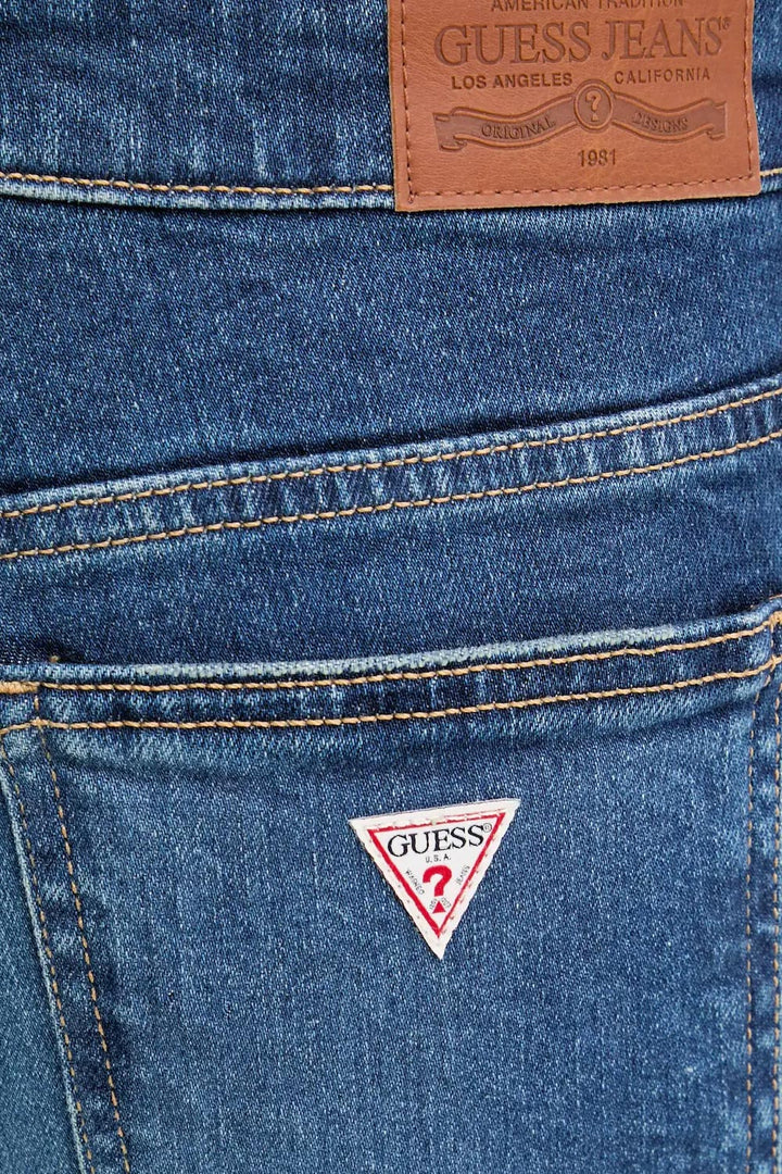 Jeans bootcut blu con scoloriture Guess